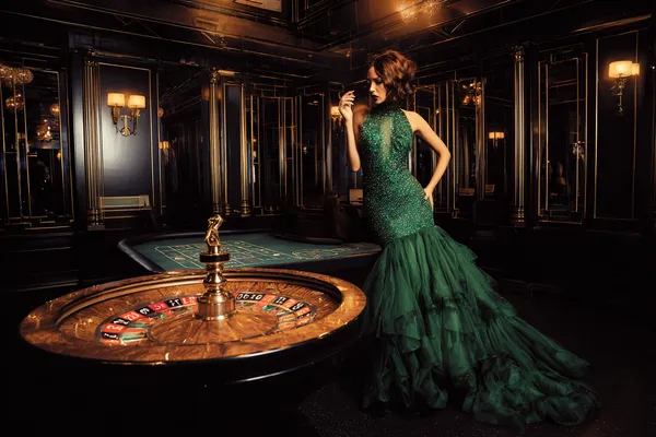 A man focused on his laptop with live stats in the background, highlighting the dedicated sports and gaming features of the JILI696 mobile app.