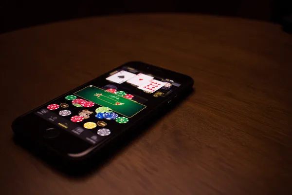 A confident dealer surrounded by casino chips inviting players to access their JILI696 account, reflecting quick and easy login options.